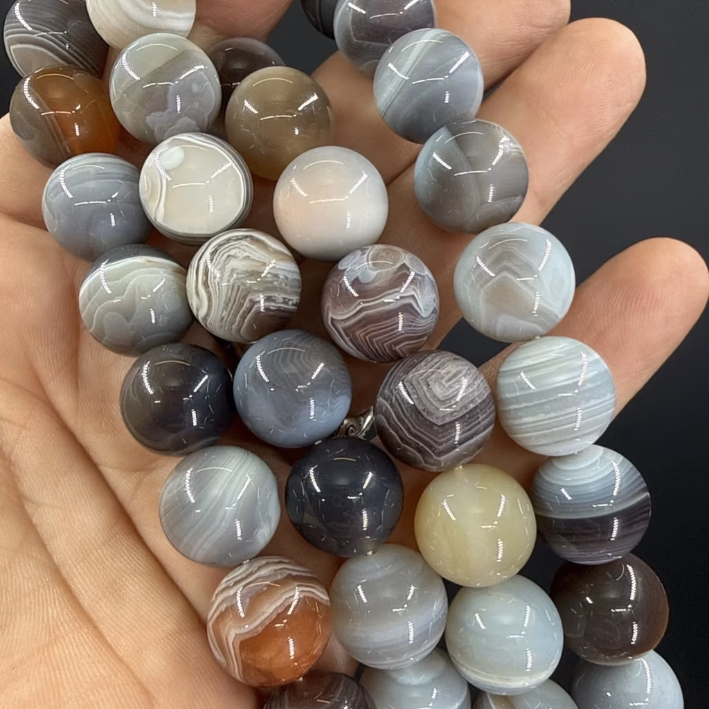 Botswana Akik Dizi 14 mm İncele ve Satın Al Botswana Akik Dizi 14 mm - Orijinal Doğal Taş ve Şifa Kristali Görsel 1