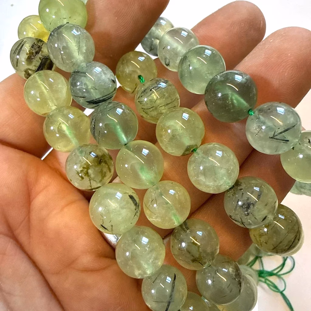 Prehnite Dizi 12 mm İncele ve Satın Al Prehnite Dizi 12 mm - Orijinal Doğal Taş ve Şifa Kristali Görsel 1