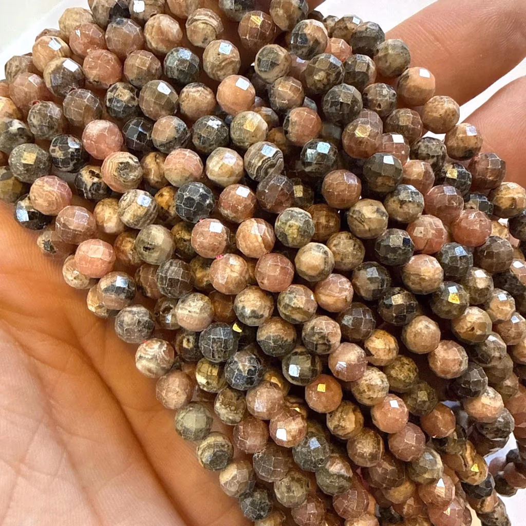 Rodokrozit Dizi Faset 6 mm - Büyütmek için tıklayın Rodokrozit Dizi Faset 6 mm - Orijinal Doğal Taş ve Şifa Kristali Görsel 1